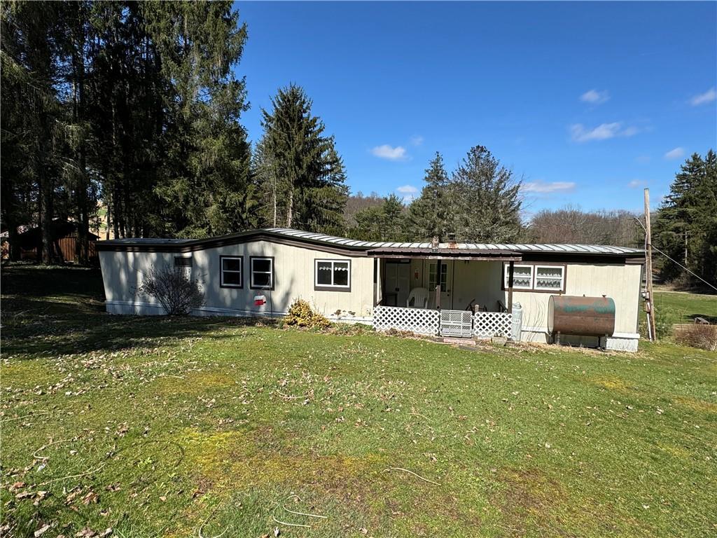 2494 Spaulding Road Clymer, PA 15728 - Photo 14 of 17 a front view of a house with garden