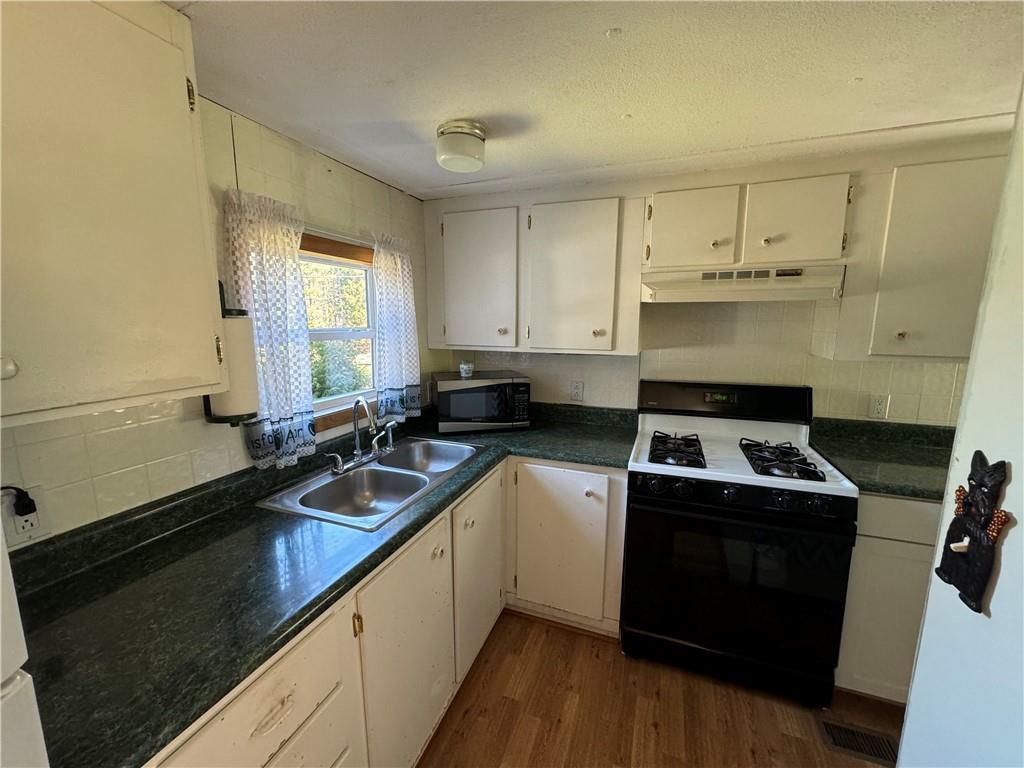 2494 Spaulding Road Clymer, PA 15728 - Photo 5 of 17 a kitchen that has a sink and a stove