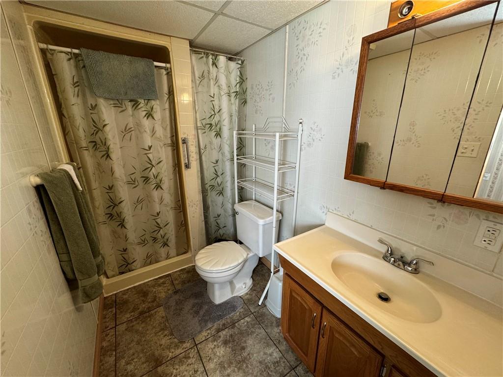 2494 Spaulding Road Clymer, PA 15728 - Photo 8 of 17 a bathroom with a sink toilet and shower