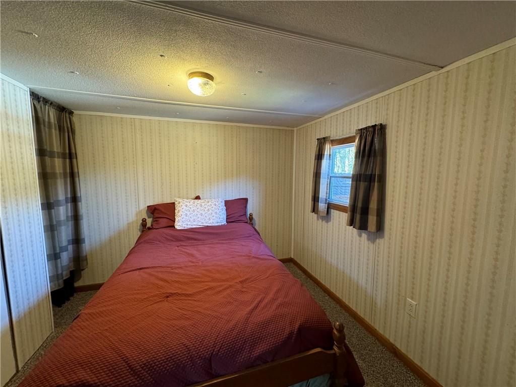 2494 Spaulding Road Clymer, PA 15728 - Photo 9 of 17 a bed room with a bed and a window