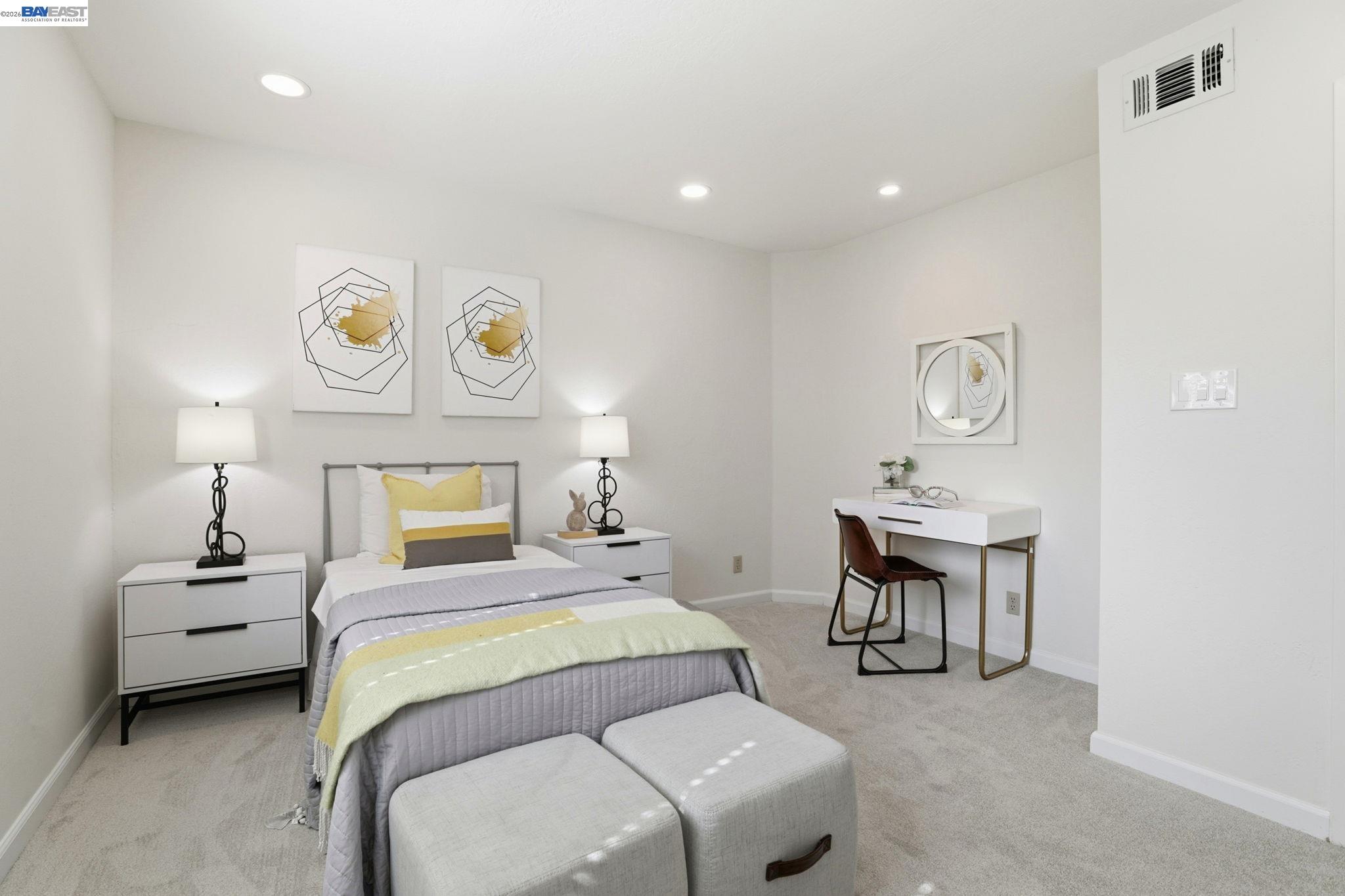 5136 Ramsgate Drive Newark, CA 94560 - Photo 22 of 59 a bedroom with a bed and a table in it