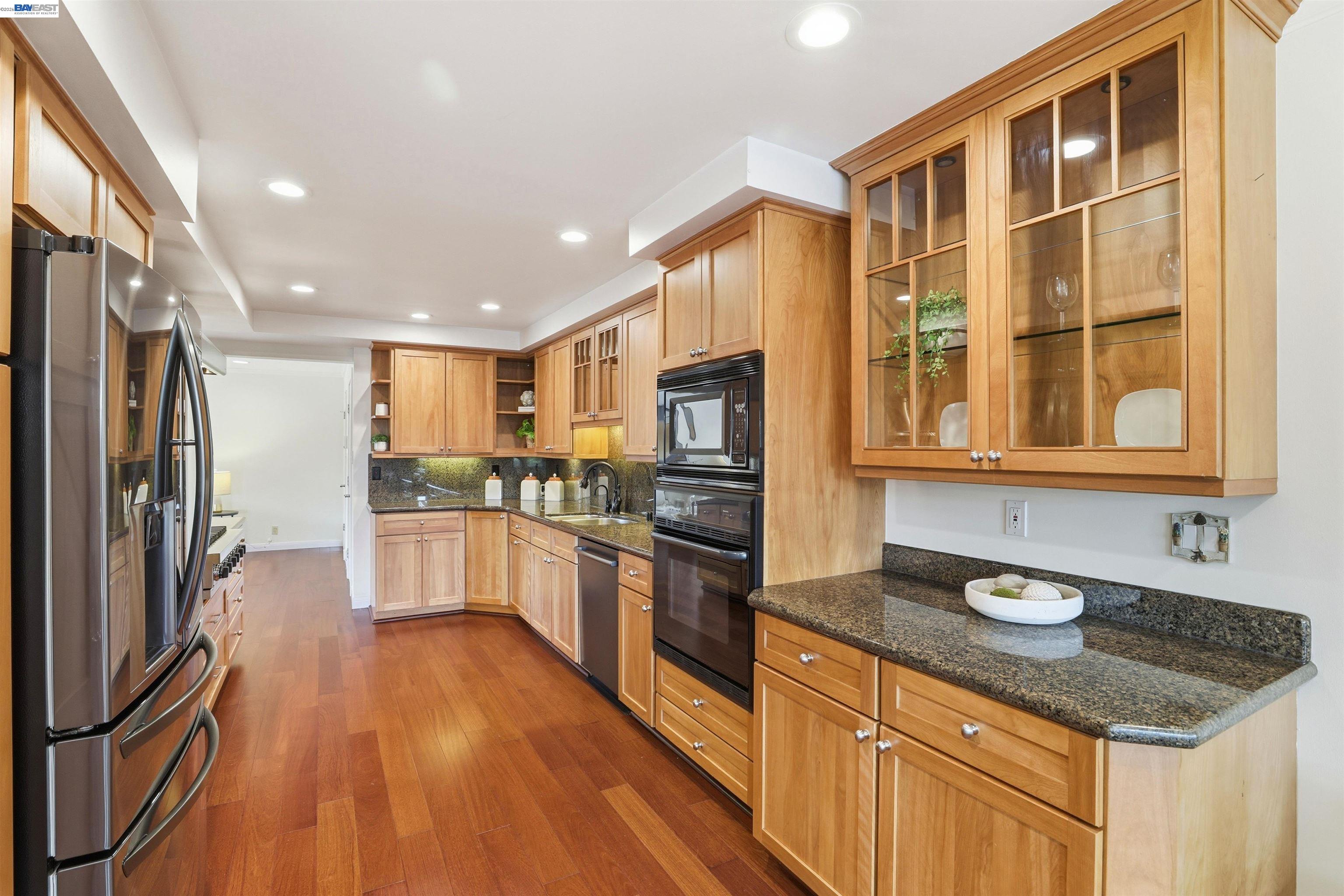 5136 Ramsgate Drive Newark, CA 94560 - Photo 30 of 59 a kitchen with stainless steel appliances granite countertop a stove and a sink