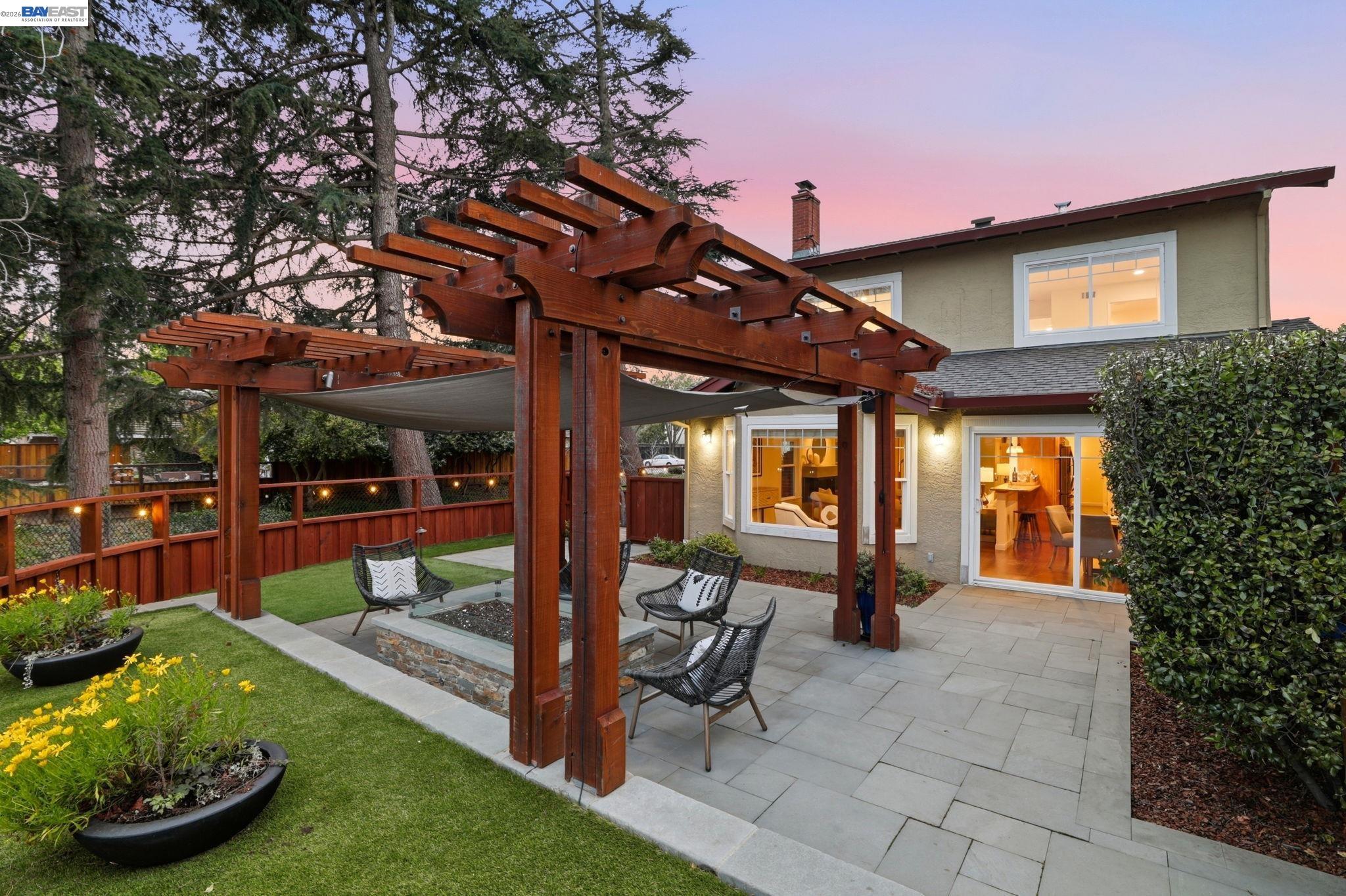 5136 Ramsgate Drive Newark, CA 94560 - Photo 3 of 59 a view of a patio with table and chairs potted plants and large tree
