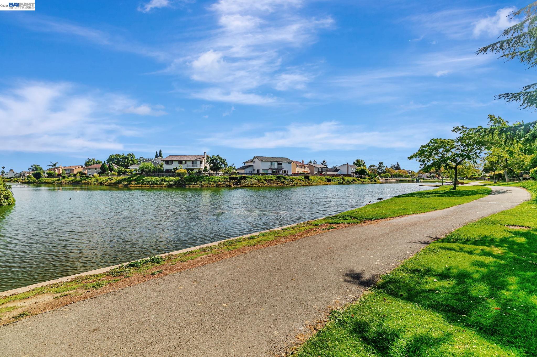 5136 Ramsgate Drive Newark, CA 94560 - Photo 49 of 59 a view of a lake with houses in the back