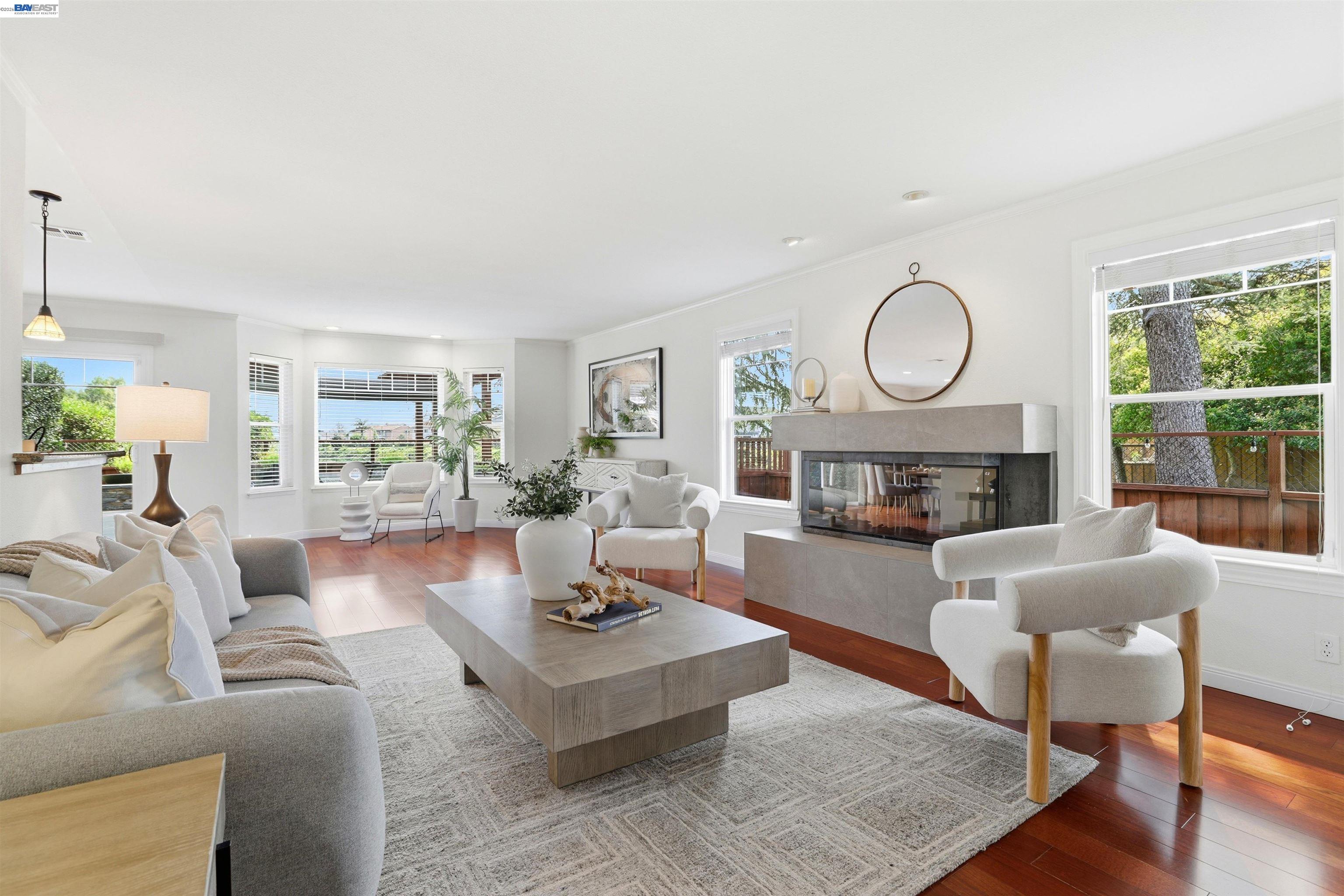 5136 Ramsgate Drive Newark, CA 94560 - Photo 55 of 59 a living room with furniture a fireplace a large window and a potted plant