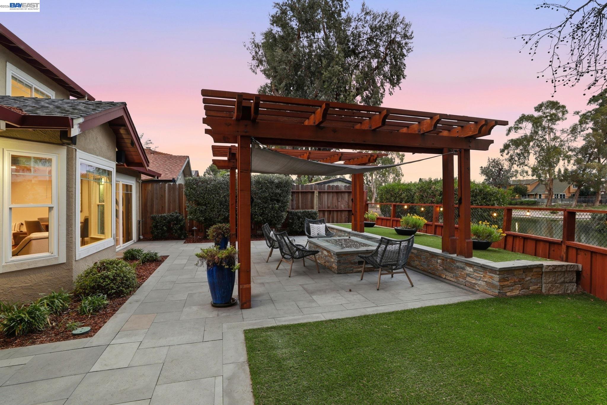 5136 Ramsgate Drive Newark, CA 94560 - Photo 8 of 59 a view of a patio with table and chairs potted plants and palm trees