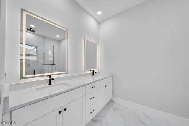 a bathroom with a shower toilet and sink