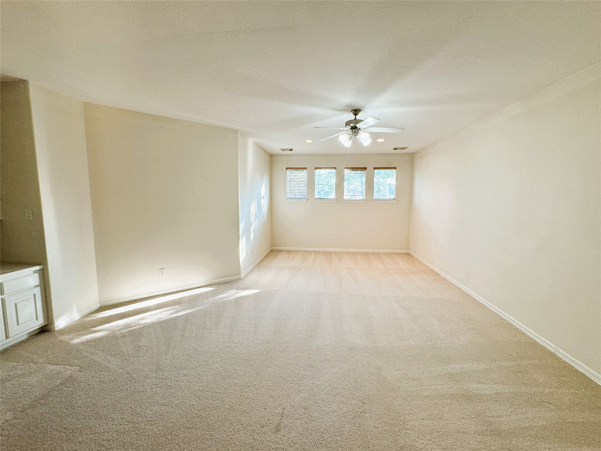 12442 Lago Bend Lane Houston, TX 77041 - Photo 21 of 31 an empty room with a empty space and windows