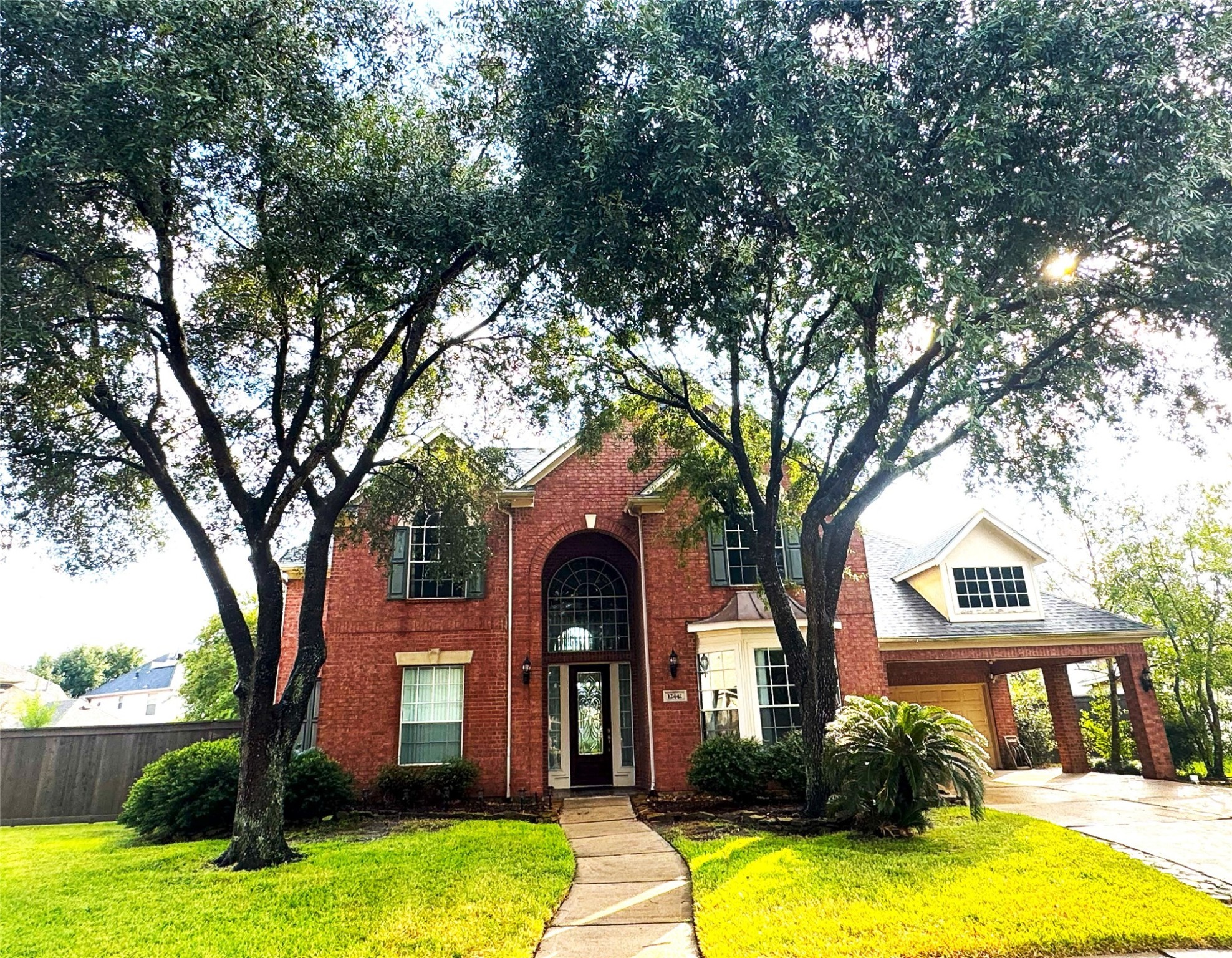 12442 Lago Bend Lane Houston, TX 77041 - Photo 31 of 31 a view of a house with yard and tree s