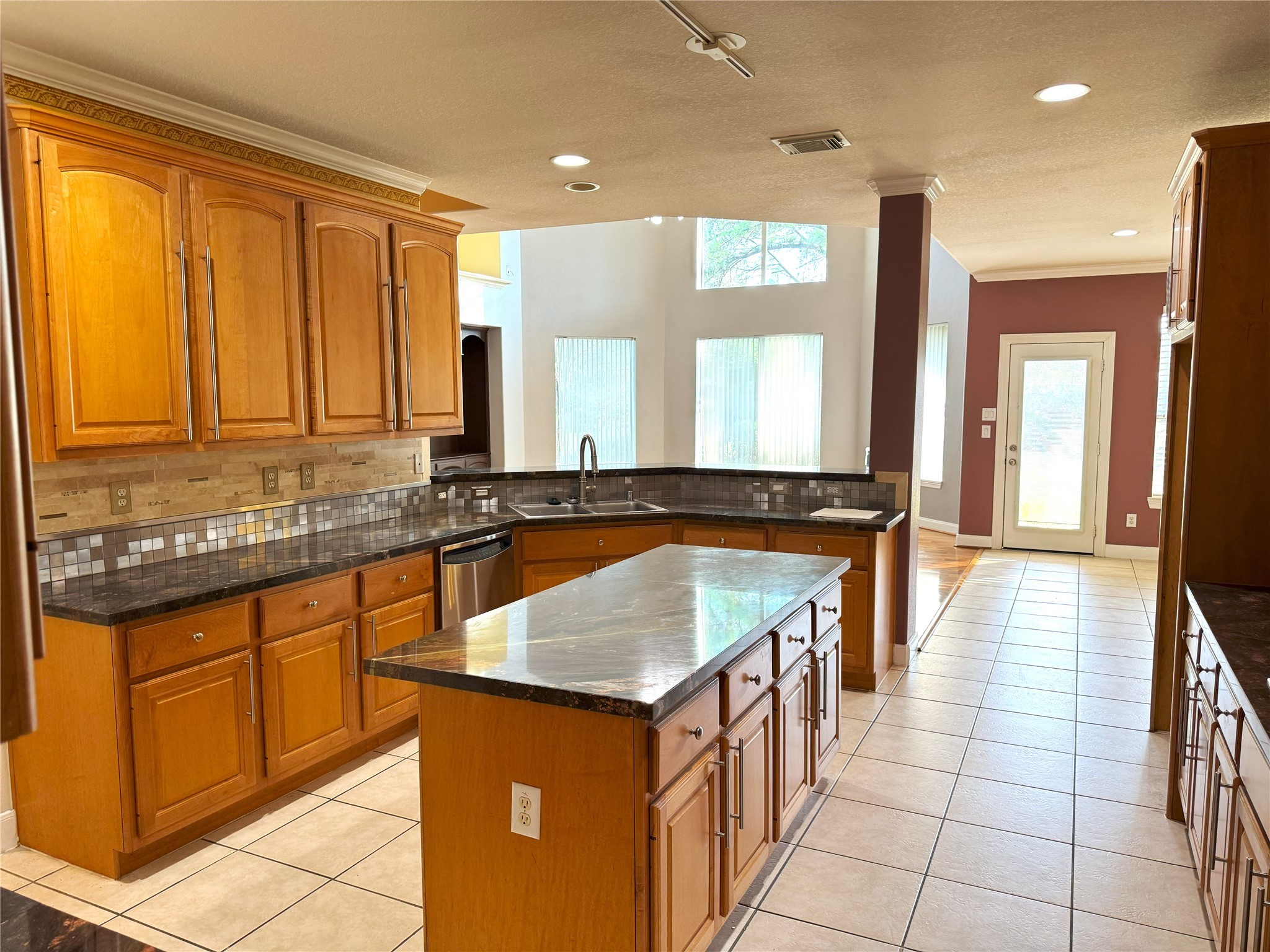12442 Lago Bend Lane Houston, TX 77041 - Photo 8 of 31 a kitchen with granite countertop a sink and a stove top oven