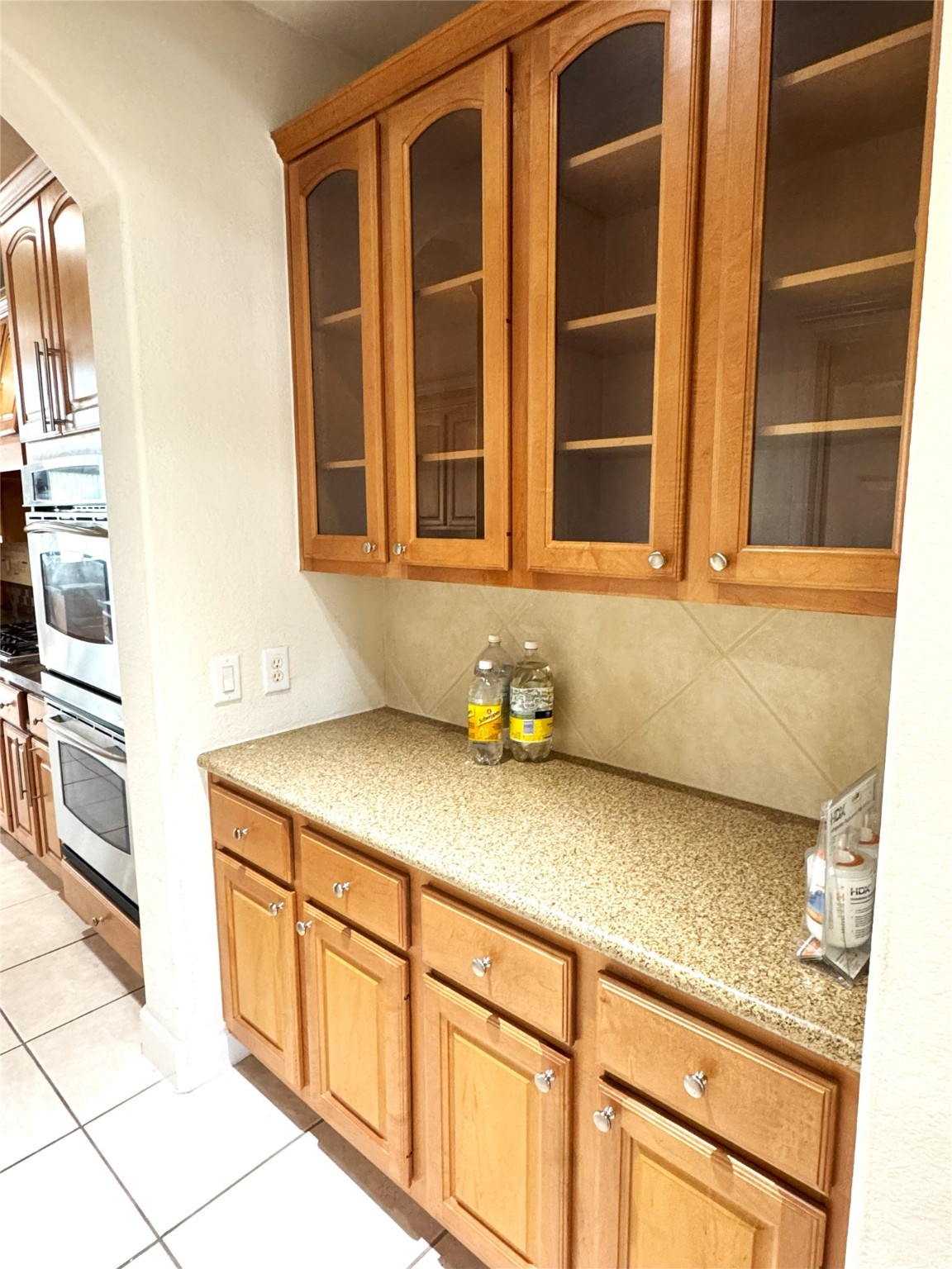 12442 Lago Bend Lane Houston, TX 77041 - Photo 9 of 31 a bathroom with a granite countertop sink and washing machine