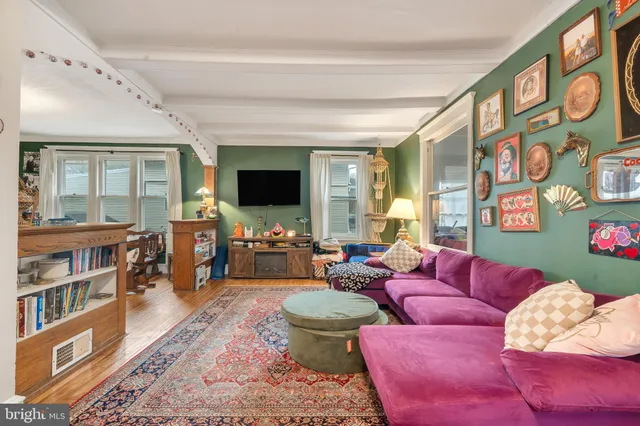 a living room with furniture fireplace and flat screen tv