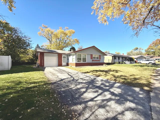 a house with swimming pool in front of it