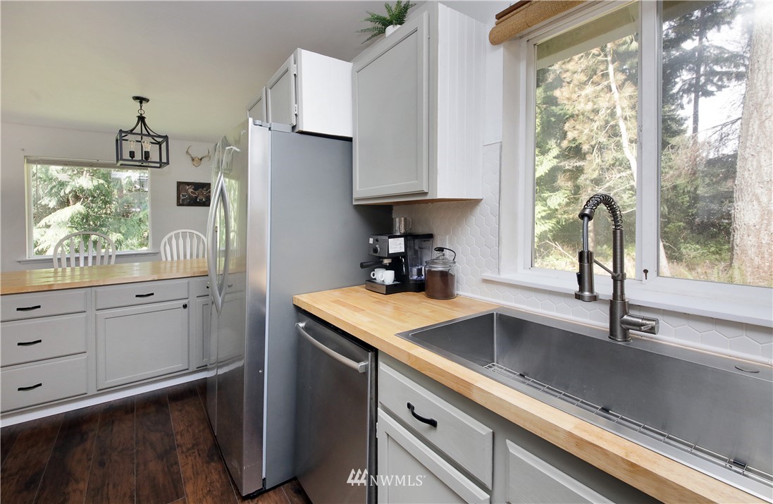3336 East Harbor Road Langley, WA 98260 - Photo 11 of 29 a kitchen with a sink and a window