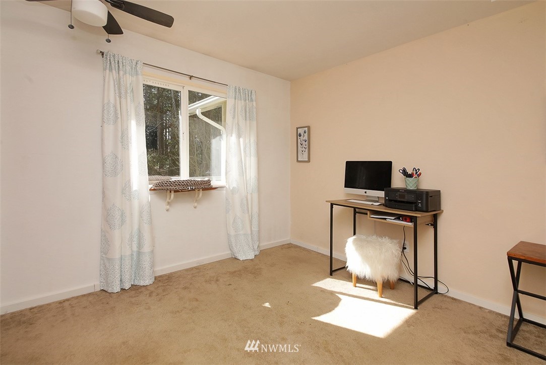 3336 East Harbor Road Langley, WA 98260 - Photo 16 of 29 a room with furniture and flat screen tv