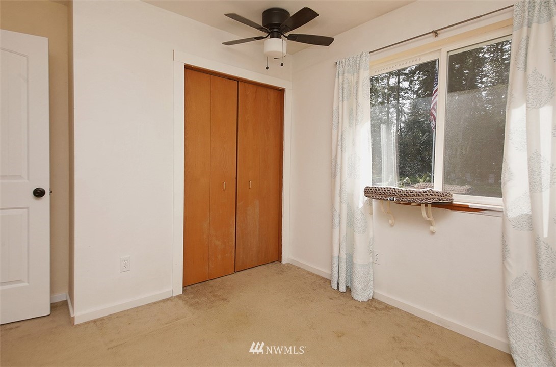 3336 East Harbor Road Langley, WA 98260 - Photo 17 of 29 a view of a hallway with a large window