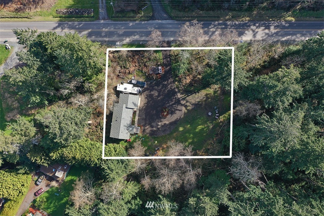 3336 East Harbor Road Langley, WA 98260 - Photo 20 of 29 an aerial view of a house with a yard basket ball court and outdoor seating