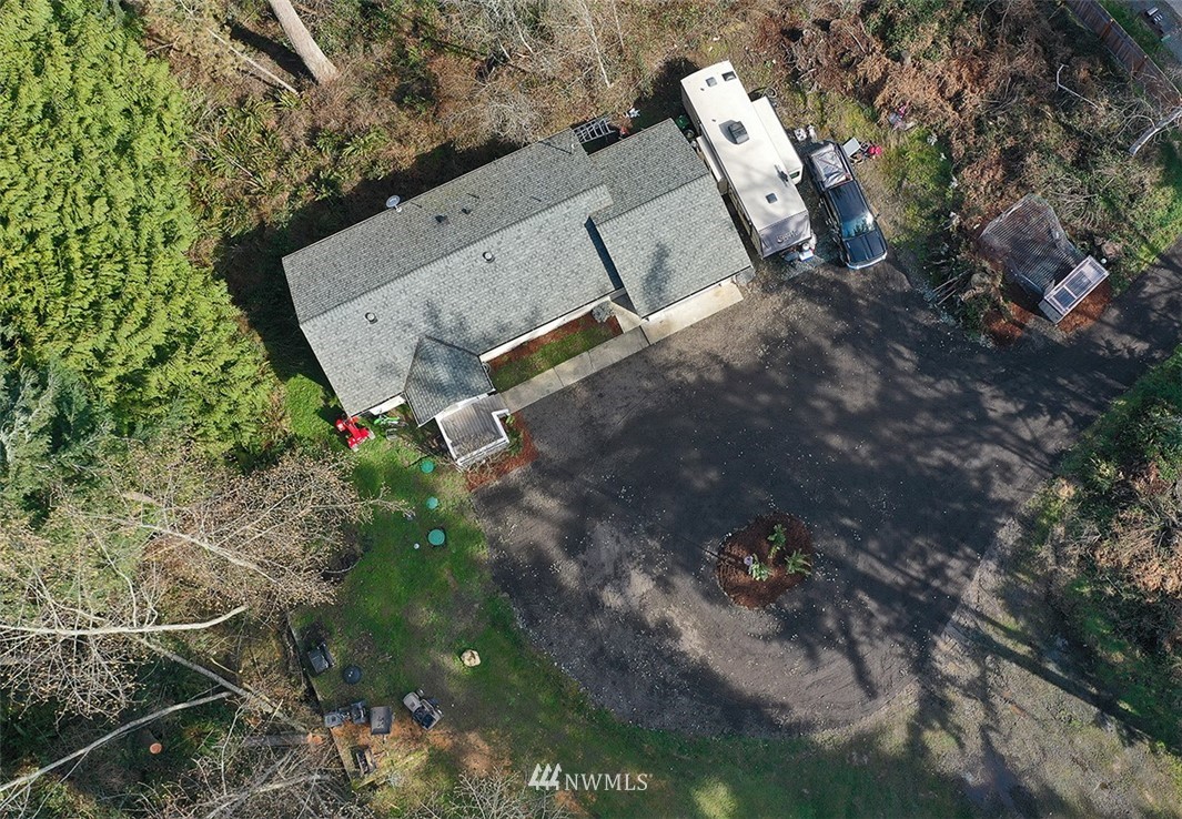 3336 East Harbor Road Langley, WA 98260 - Photo 21 of 29 an aerial view of a house with a yard and tree s