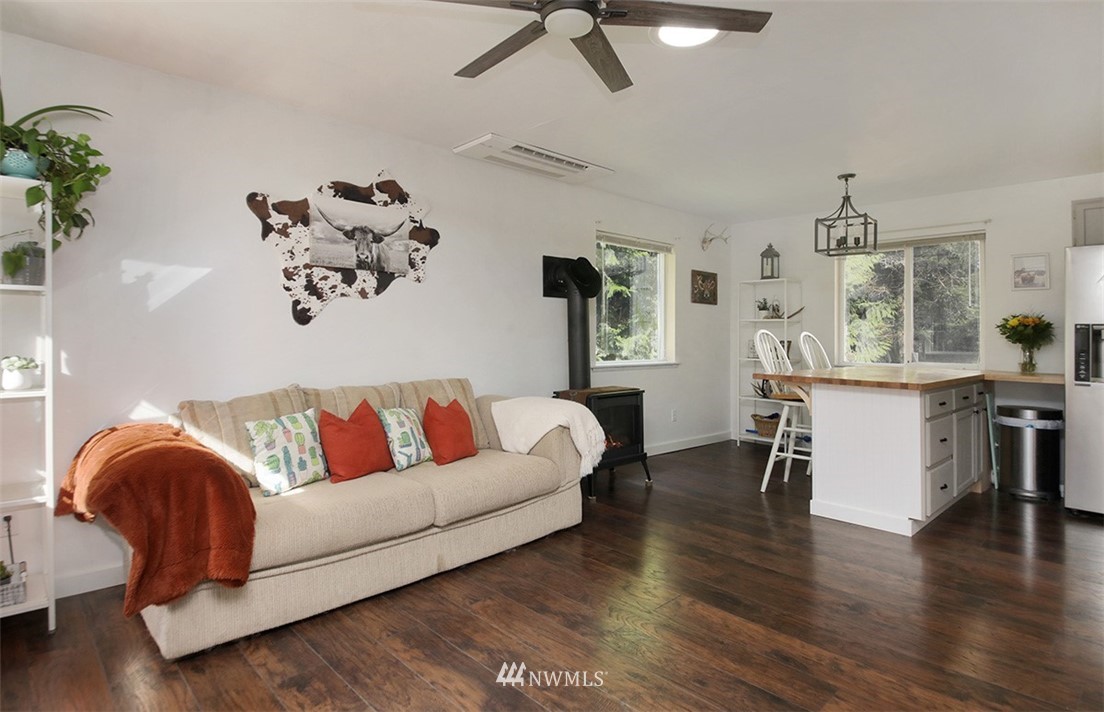 3336 East Harbor Road Langley, WA 98260 - Photo 8 of 29 a living room with furniture and wooden floor