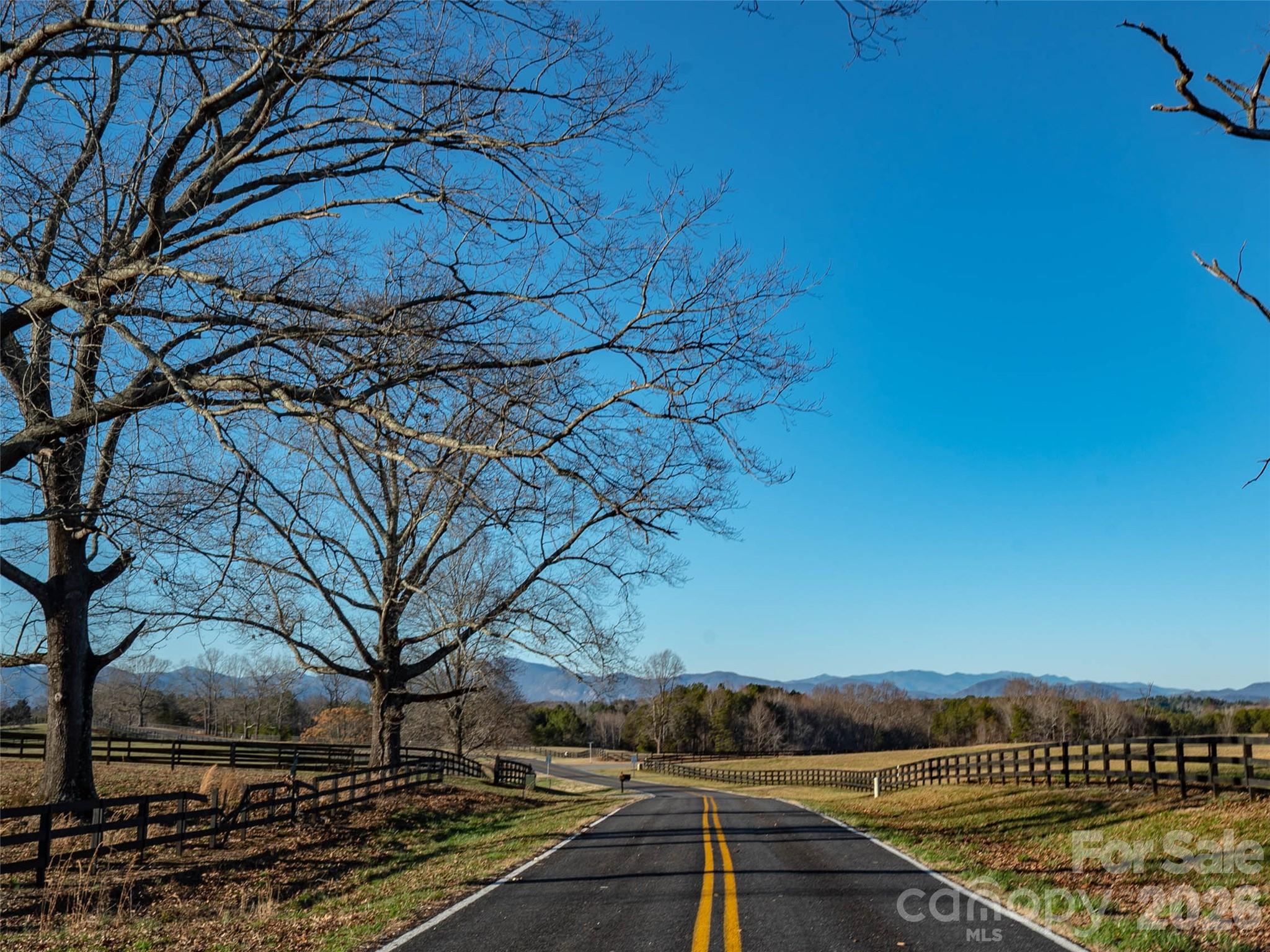 Lot 48.1 A R Thompson Road Mill Spring, NC 28756 - Photo 4 of 22 a view of a lake with houses