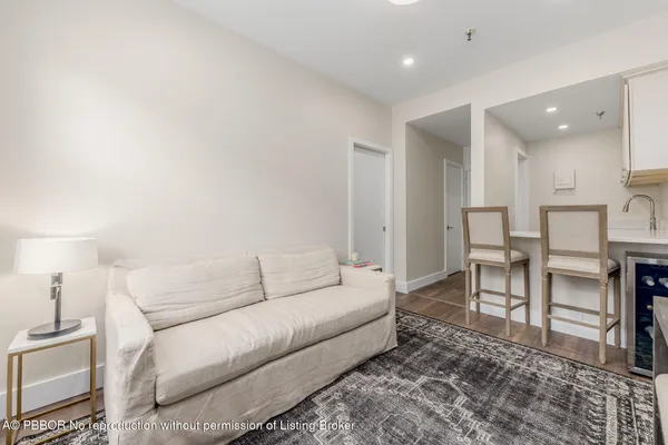a living room with furniture and a rug