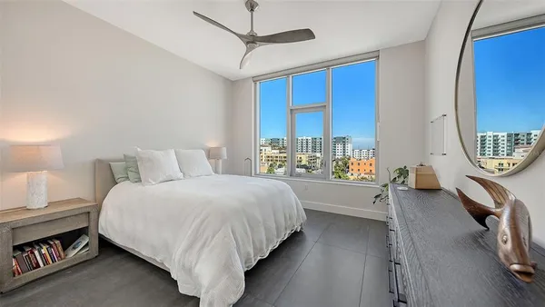 a bed room with a bed and a window