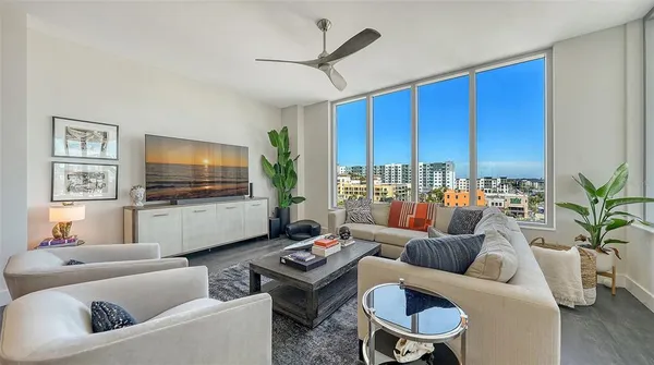 a living room with furniture and a flat screen tv