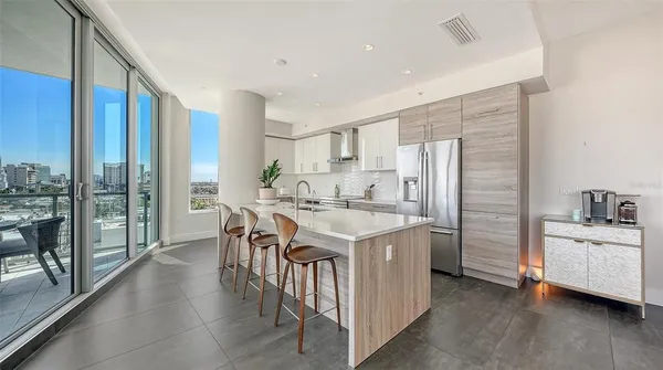 a kitchen with a sink a stove and a refrigerator