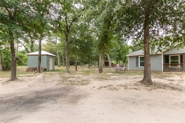 a house with trees in the background