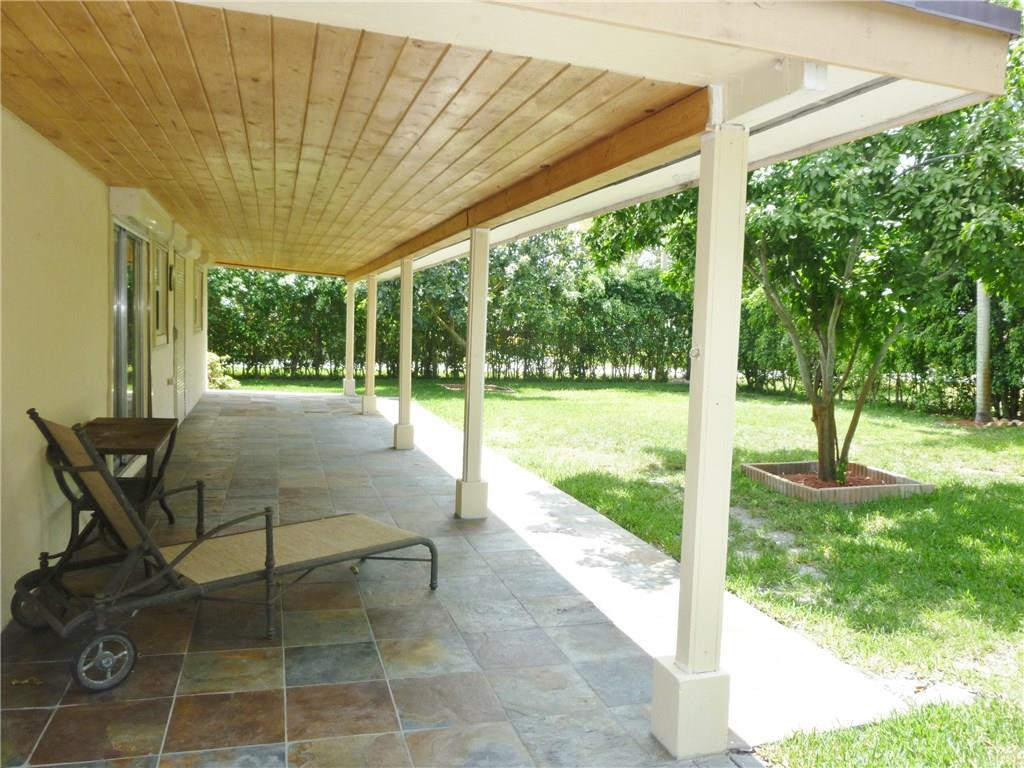 7305 Northwest 95th Way Tamarac, FL 33321 - Photo 13 of 14 a building view with a garden space