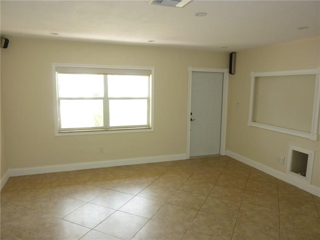 7305 Northwest 95th Way Tamarac, FL 33321 - Photo 5 of 14 a view of an empty room with a window