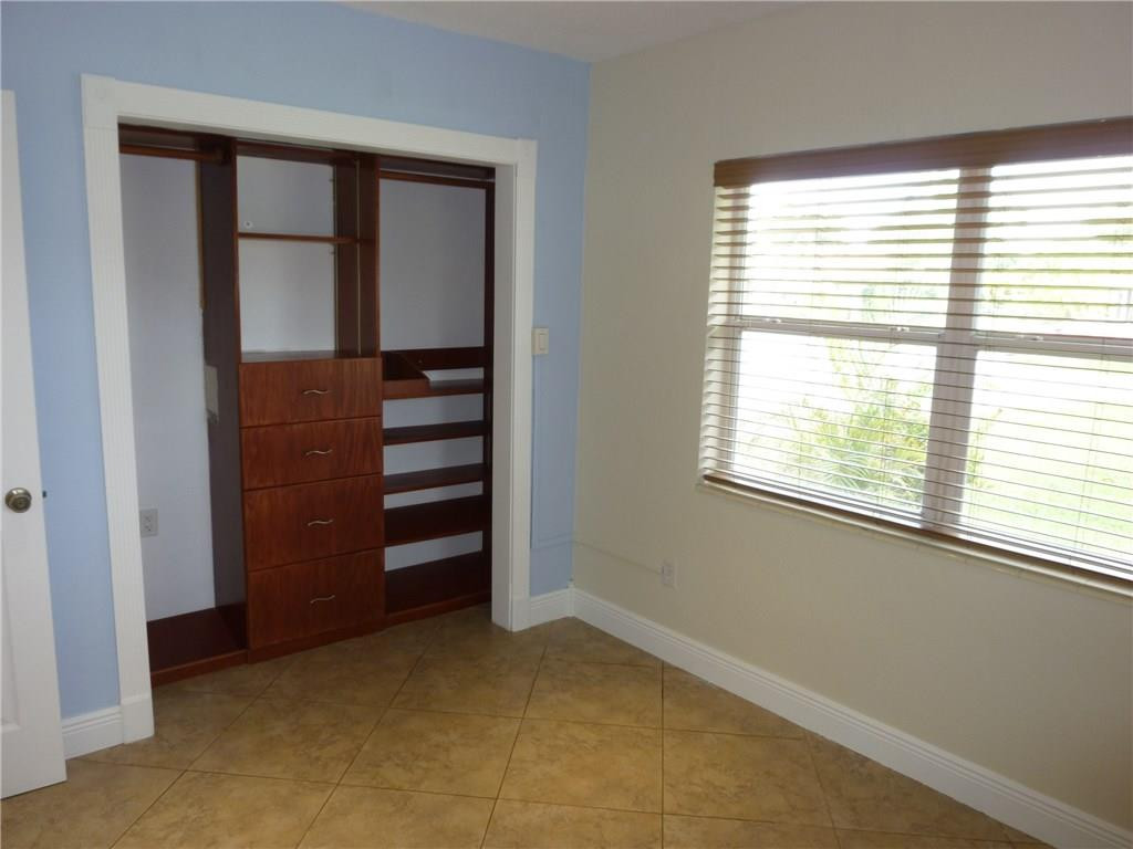 7305 Northwest 95th Way Tamarac, FL 33321 - Photo 6 of 14 a view of room with a window and a dresser