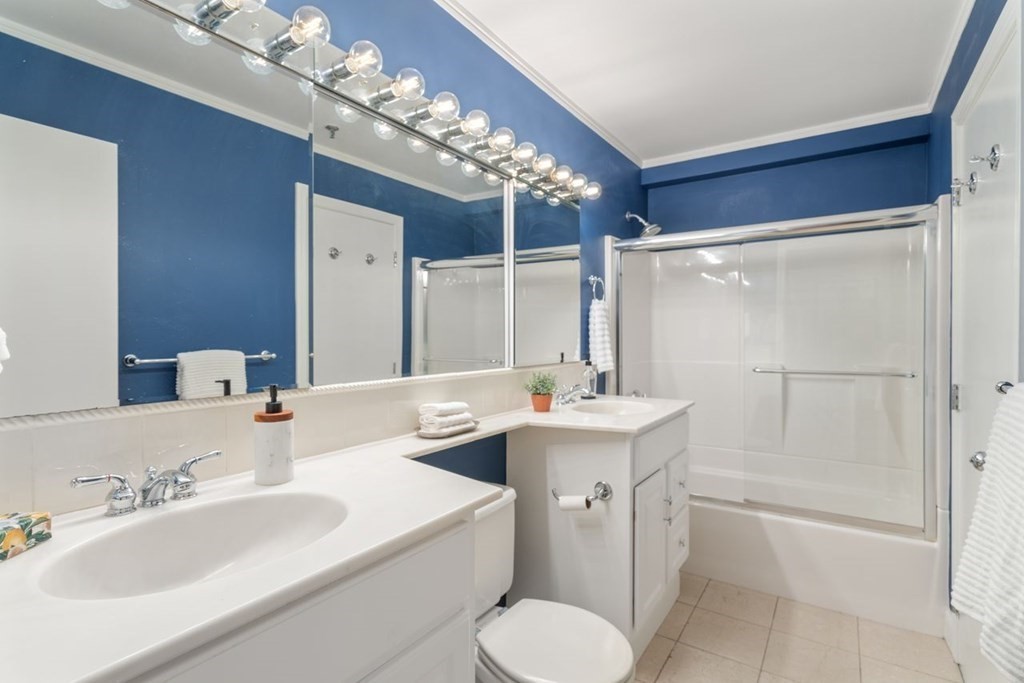 350 North Street, Unit 400 Boston, MA 02113 - Photo 11 of 24 a bathroom with a sink toilet tub and shower