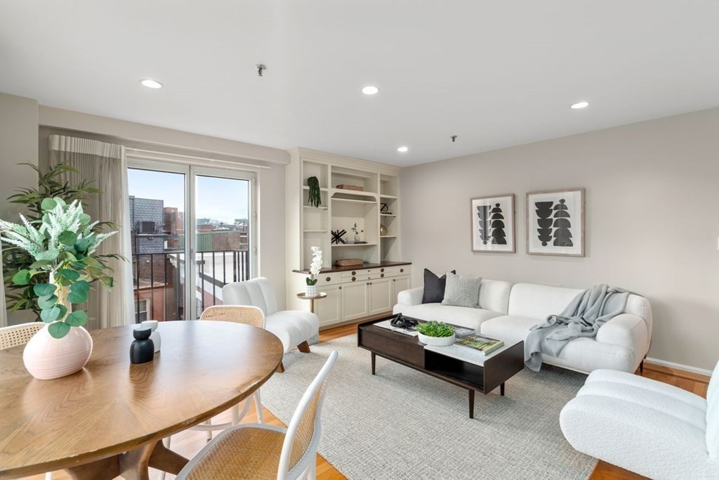 350 North Street, Unit 400 Boston, MA 02113 - Photo 2 of 24 a living room with furniture and a large window