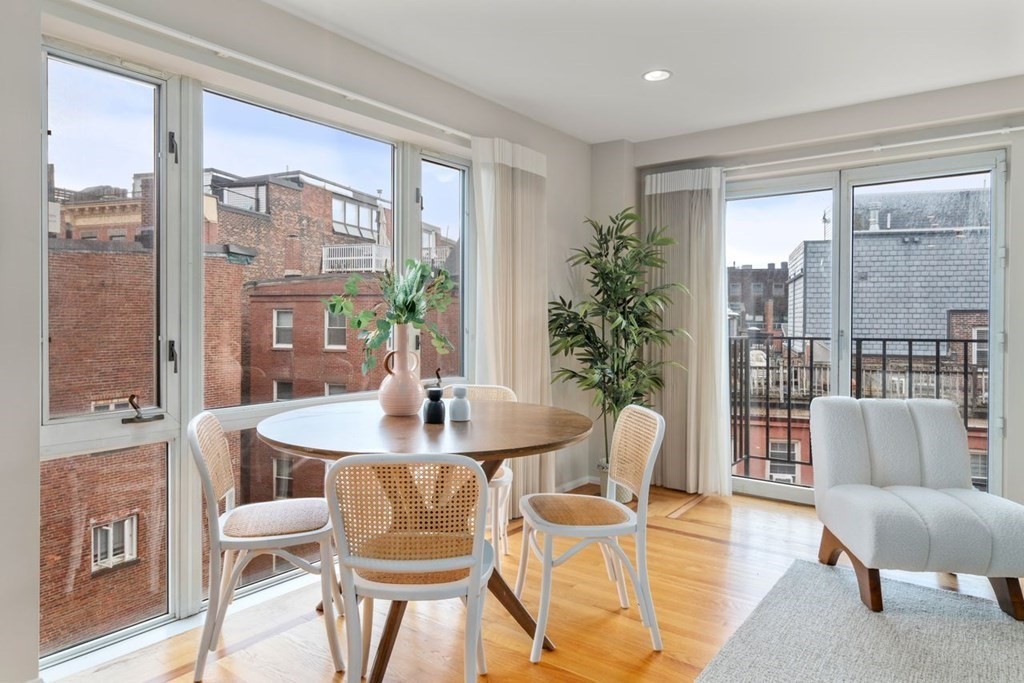 350 North Street, Unit 400 Boston, MA 02113 - Photo 3 of 24 a dining room with furniture and wooden floor
