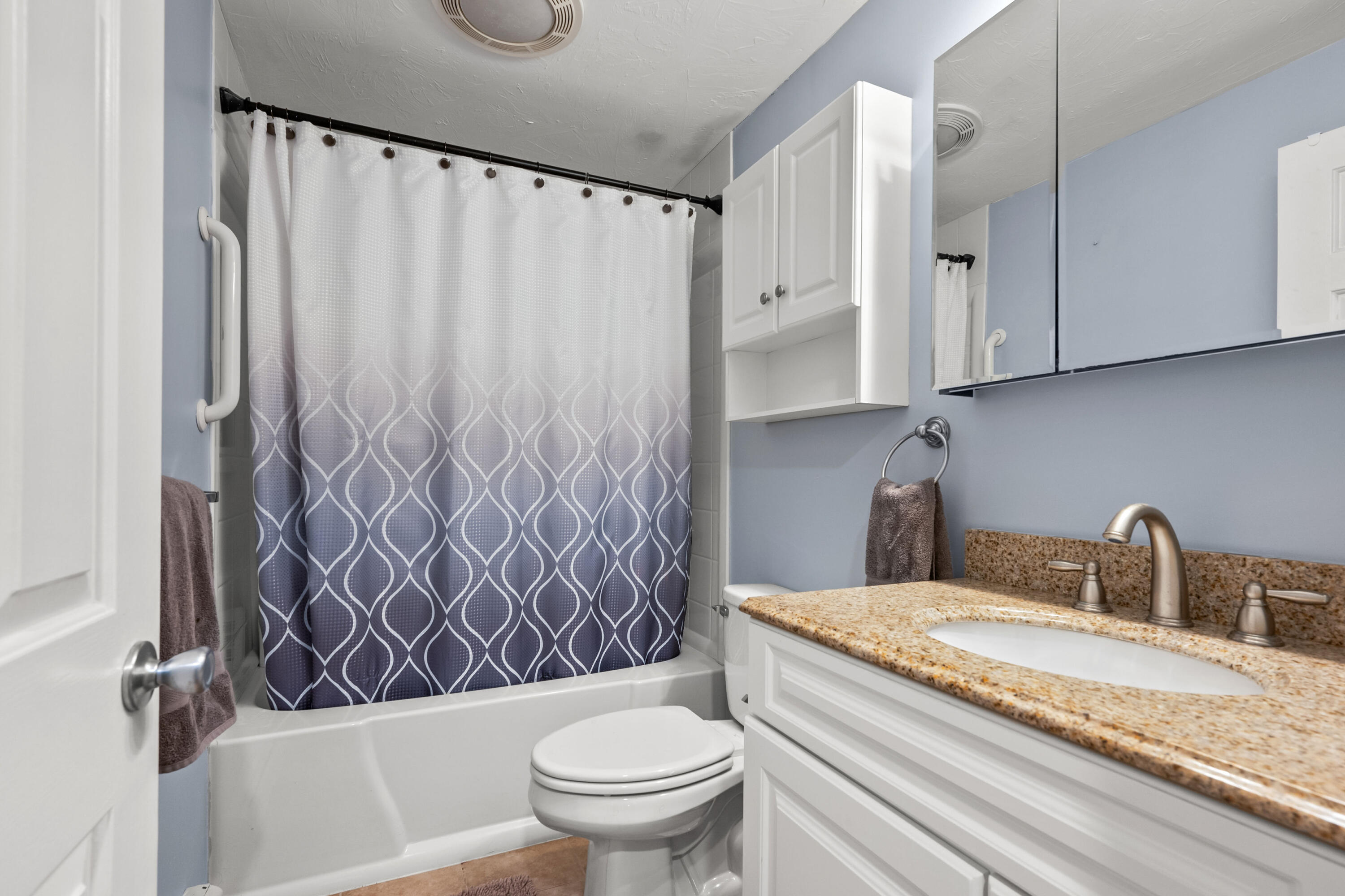 56 Allan Road West Barnstable, MA 02668 - Photo 20 of 21 a bathroom with a granite countertop bathtub sink vanity mirror and toilet