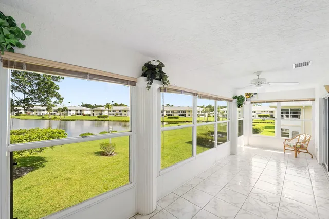 a lobby with furniture and floor to ceiling window