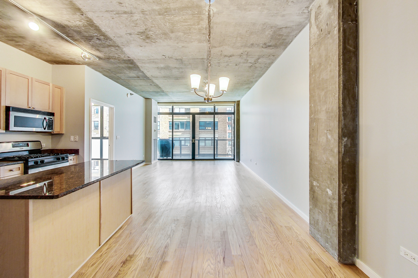 321 South Sangamon Street, Unit 408 Chicago, IL 60607 - Photo 13 of 31 a view of a kitchen from the hallway