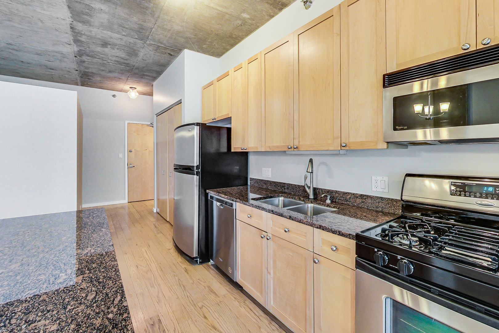 321 South Sangamon Street, Unit 408 Chicago, IL 60607 - Photo 15 of 31 a kitchen with a sink stove and refrigerator