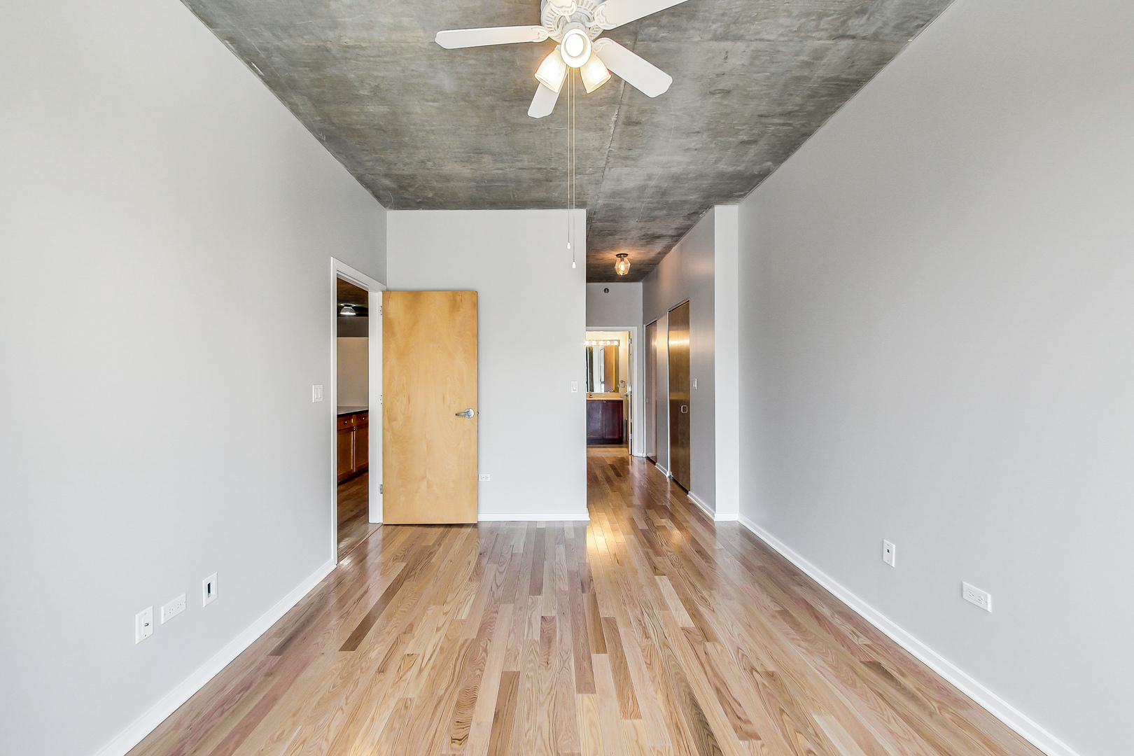321 South Sangamon Street, Unit 408 Chicago, IL 60607 - Photo 19 of 31 a view of a hallway with wooden floor