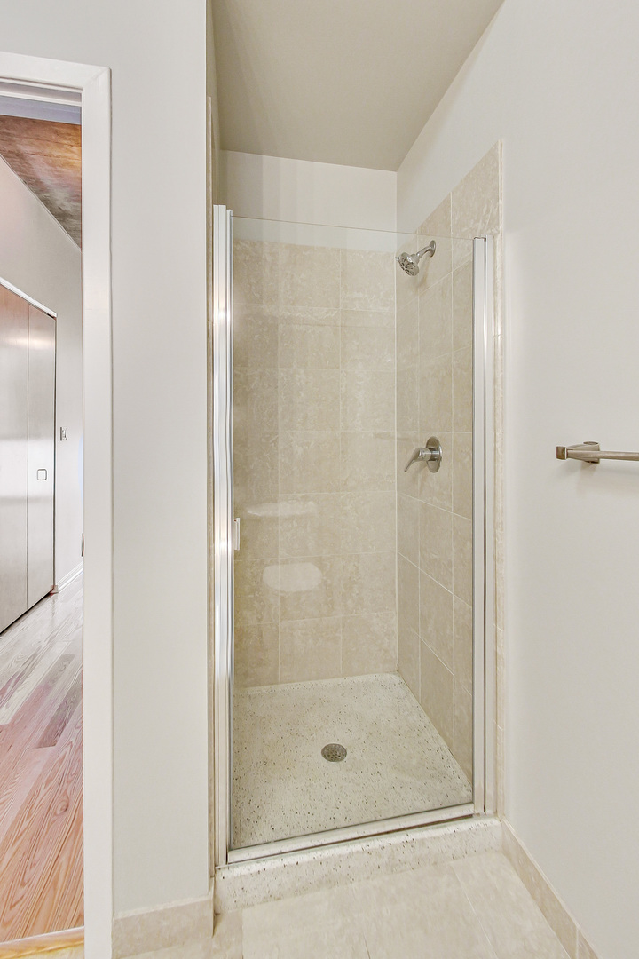 321 South Sangamon Street, Unit 408 Chicago, IL 60607 - Photo 21 of 31 a bathroom with a shower