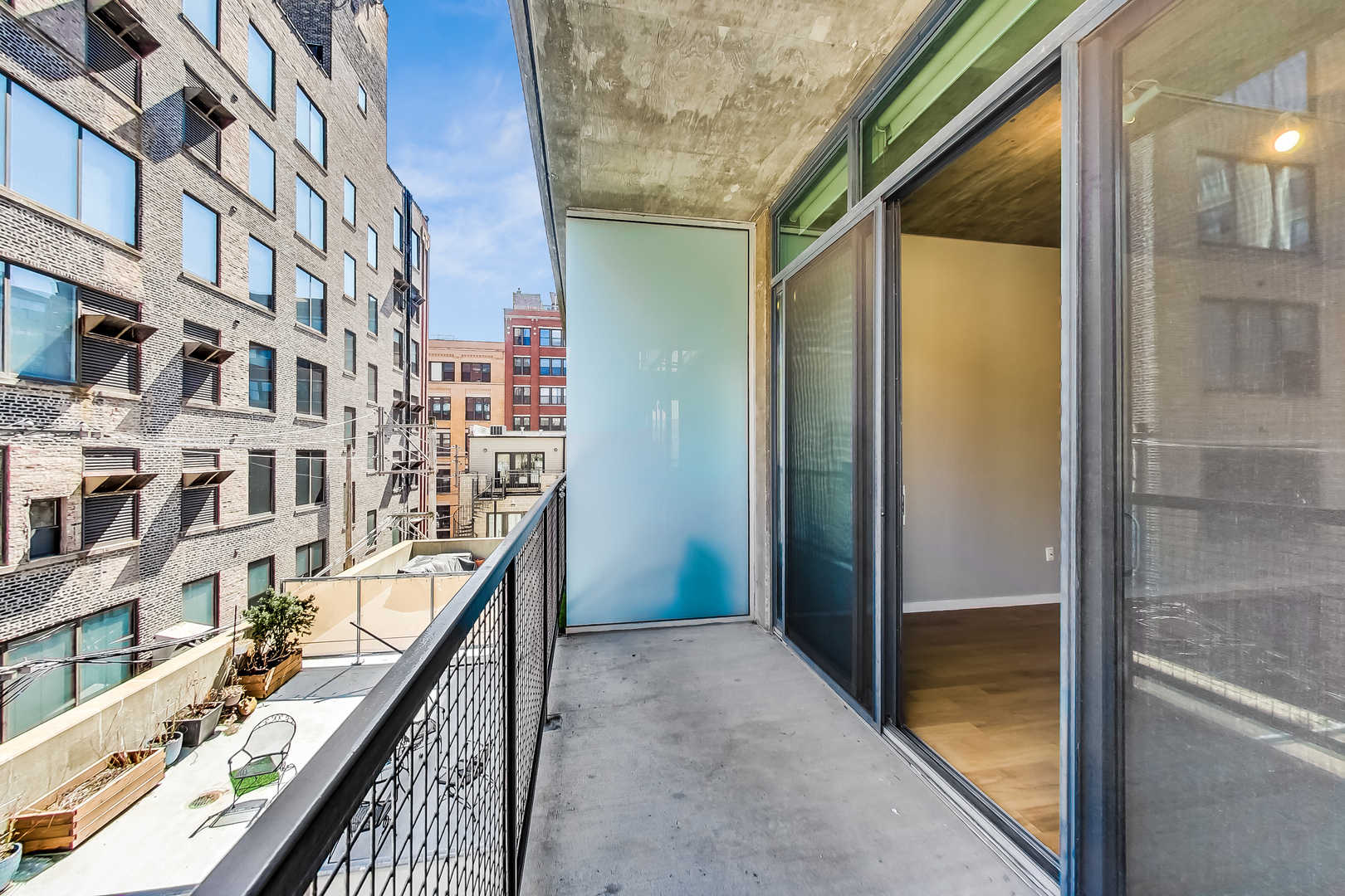 321 South Sangamon Street, Unit 408 Chicago, IL 60607 - Photo 28 of 31 a balcony view with an outdoor seating