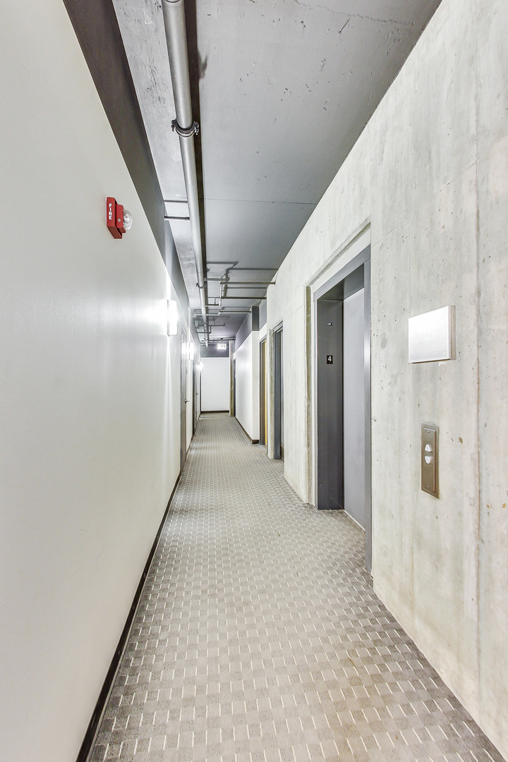 321 South Sangamon Street, Unit 408 Chicago, IL 60607 - Photo 5 of 31 a view of hallway with wooden floor