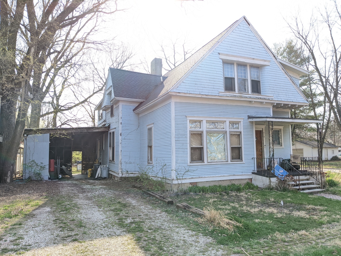 210 South Grove Street Urbana, IL 61802 - Photo 2 of 2 a view of a house with a yard and large tree