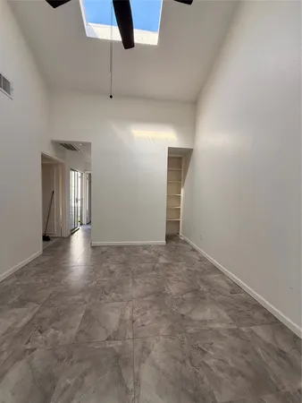 a view of empty room with windows