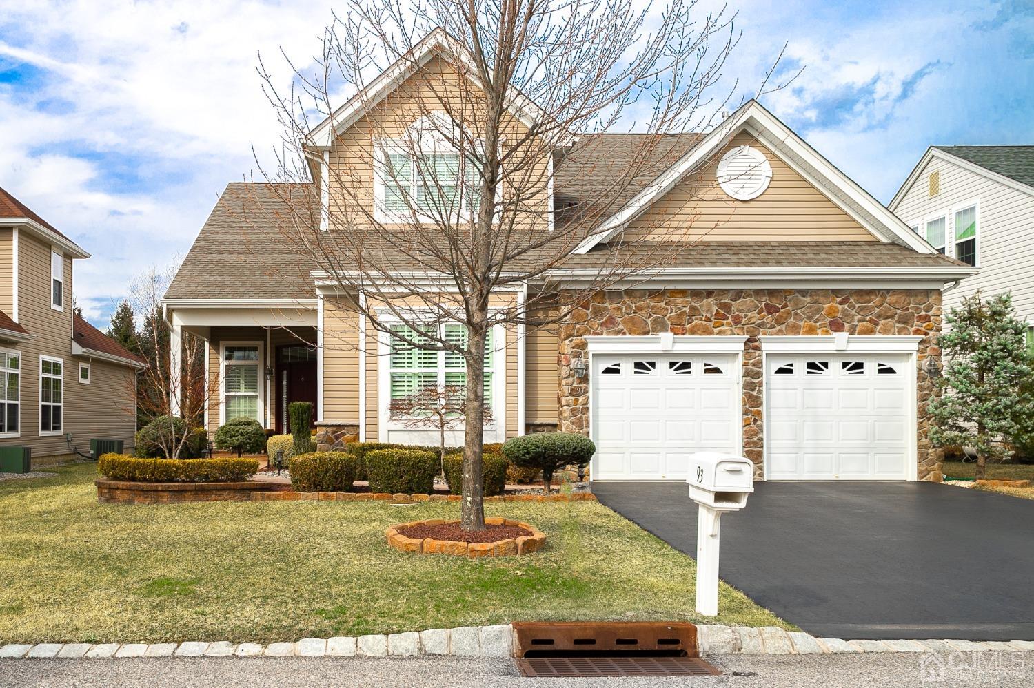 a front view of a house with garden