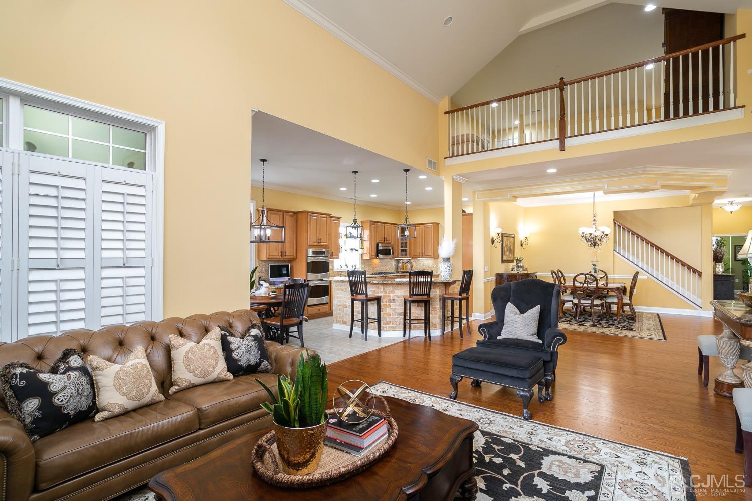 93 Timber Hill Drive Monroe Township, NJ 08831 - Photo 12 of 40 a living room with furniture kitchen and a table
