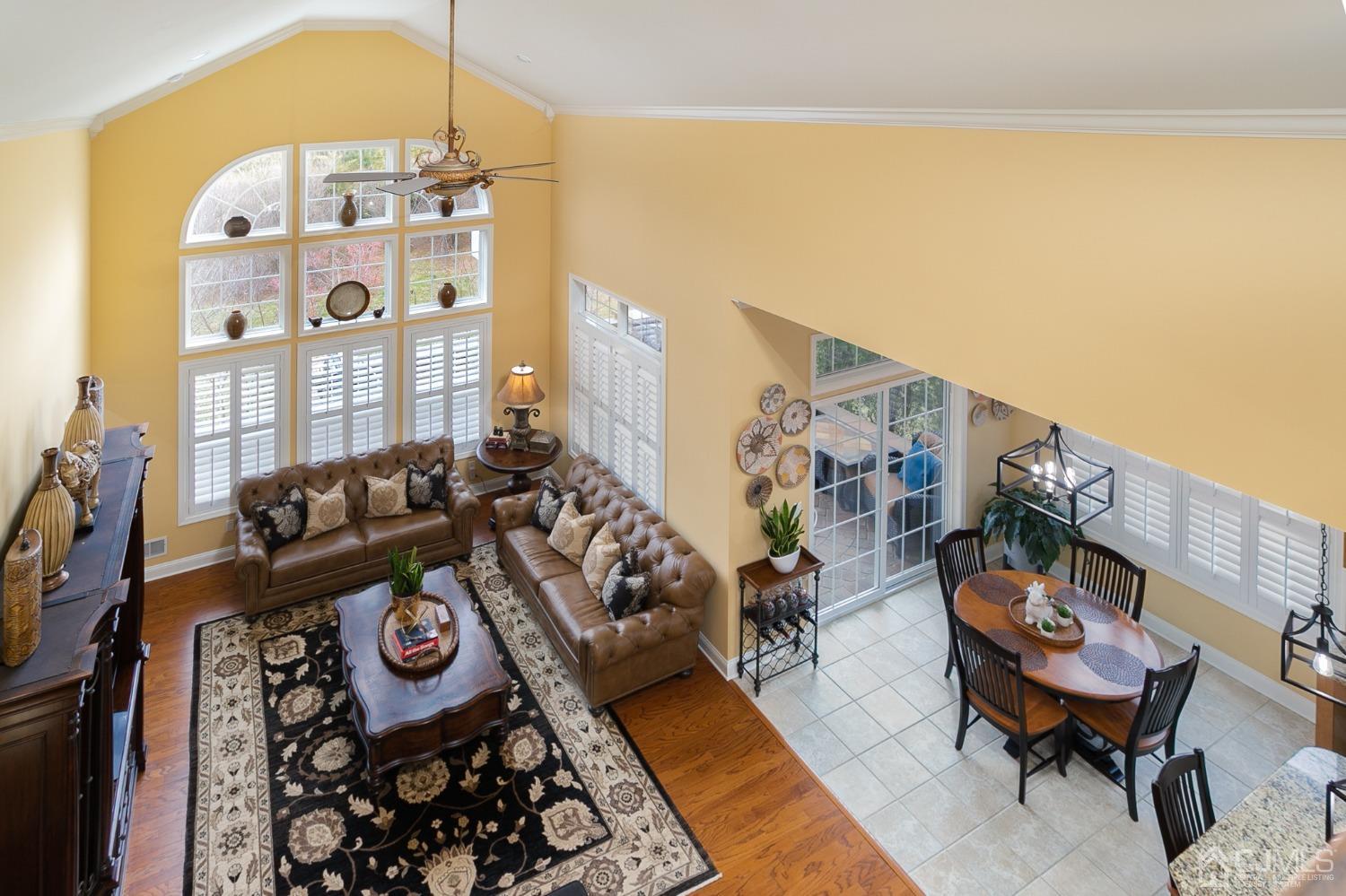 93 Timber Hill Drive Monroe Township, NJ 08831 - Photo 13 of 40 a living room with furniture and a chandelier
