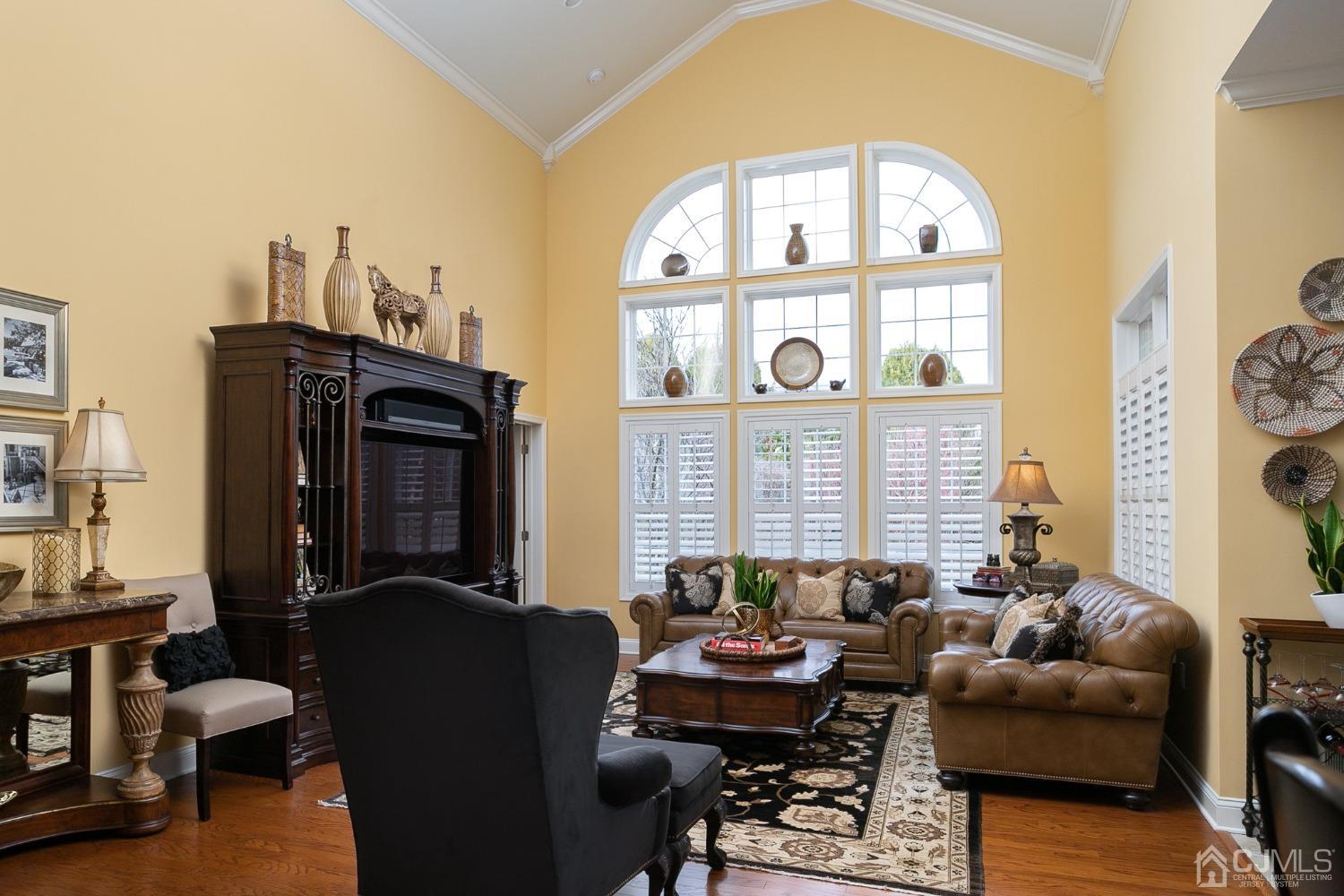 93 Timber Hill Drive Monroe Township, NJ 08831 - Photo 14 of 40 a living room with furniture a fireplace and a large window