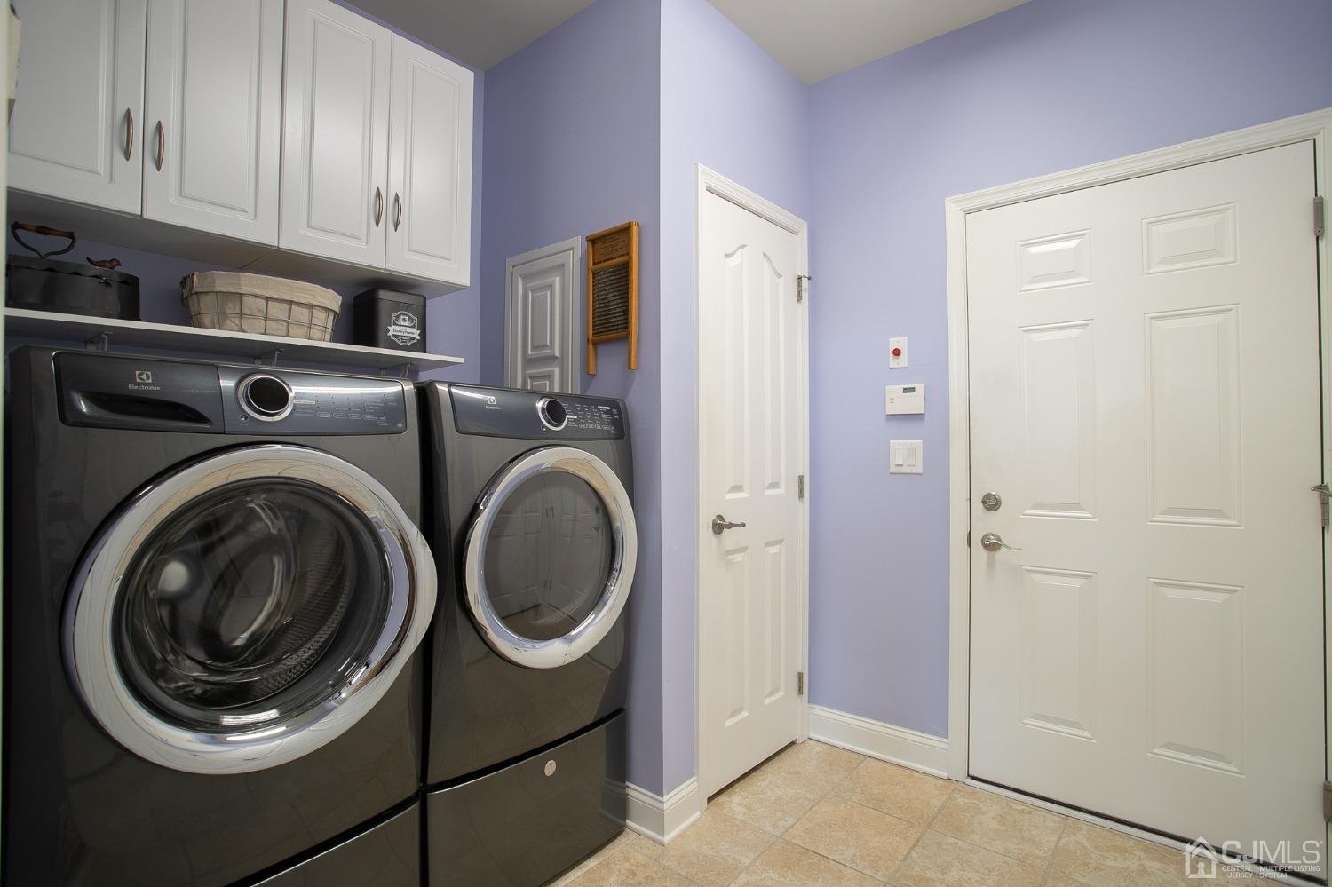 93 Timber Hill Drive Monroe Township, NJ 08831 - Photo 18 of 40 a utility room with dryer and washer